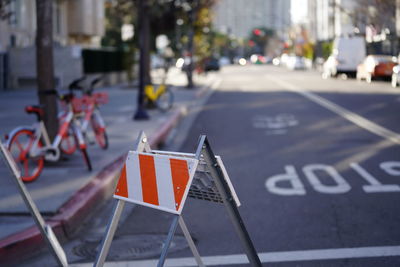 Close-up of flag on road in city