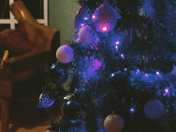 Close-up of illuminated christmas tree at night