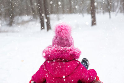 Snowman on snow covered field