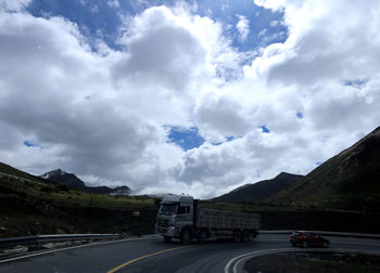 Cars on road against sky