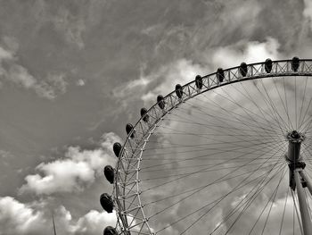 Low angle view of ferris wheel against sky