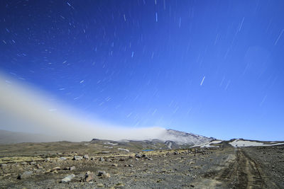 Scenic view of landscape against sky at night