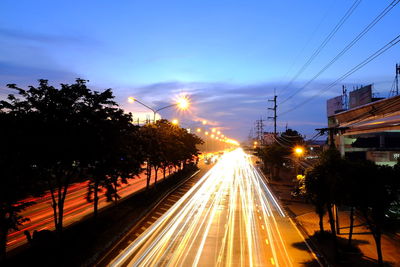 Light trails on street in city at night