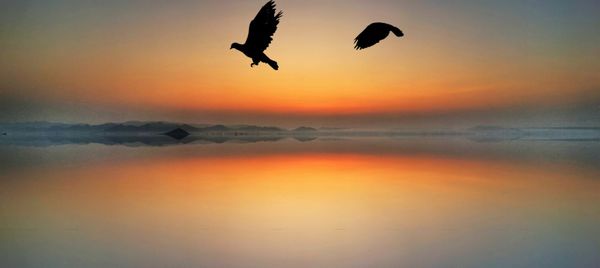 Scenic view of sea against sky during sunset