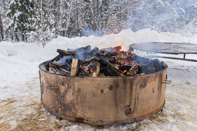 Closeup of huge campfire in the winter forest for warm