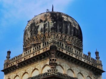 Low angle view of historical building against clear blue sky