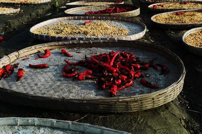 Spices in wicker trays drying outdoors