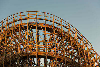 Curve of a large wooden roller coaster
