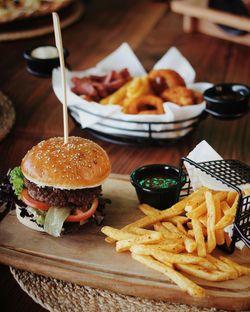 Hamburger with french fries and hot snacks plate