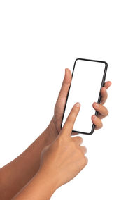 Midsection of person holding smart phone against white background