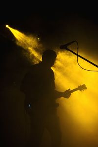 Low angle view of illuminated people at night