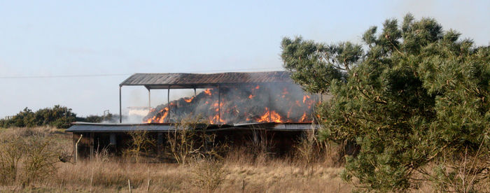 Built structure on field against clear sky