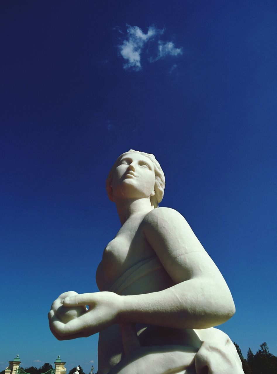 blue, low angle view, sculpture, statue, human representation, art and craft, art, creativity, clear sky, sky, copy space, sunlight, day, outdoors, no people, monument, travel destinations, travel