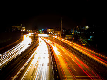 High angle view of light trails on road at night