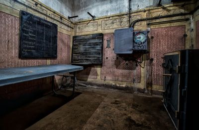 Empty bench in abandoned building