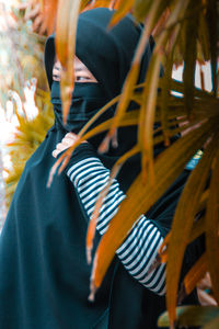 Close-up of person holding leaf