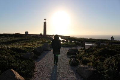 Silhouette of people at sunset