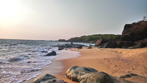 Scenic view of beach against sky during sunset