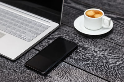 High angle view of coffee cup on table