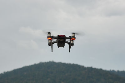 Low angle view of camera against sky