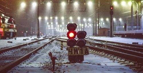 Illuminated railroad tracks during winter