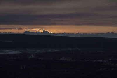 Silhouette landscape against sky during sunset