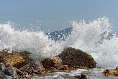 Water splashing on rocks at sea shore