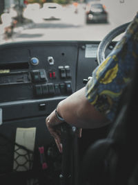 Midsection of man sitting in airplane