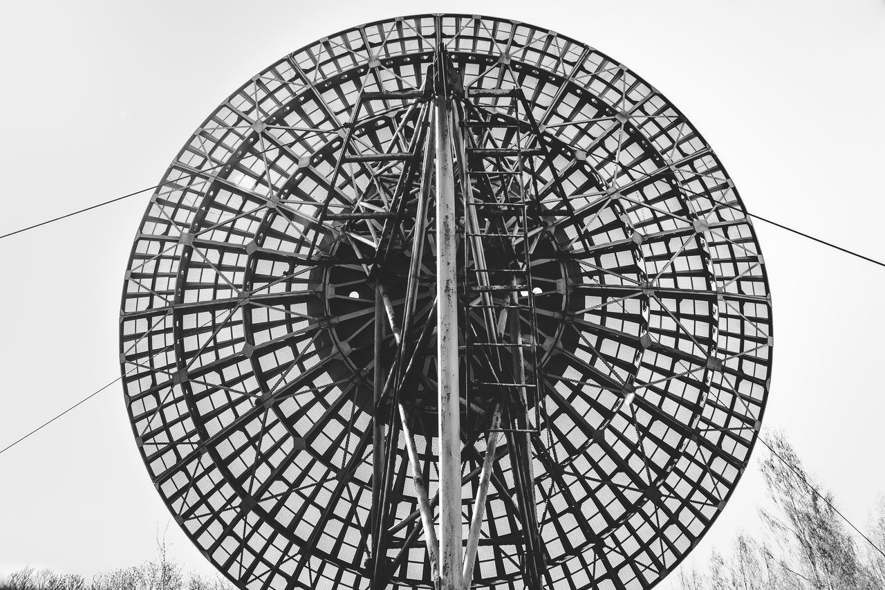 LOW ANGLE VIEW OF WHEEL AGAINST SKY