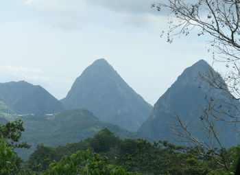 Scenic view of mountains against cloudy sky