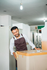 Portrait of young man working in office