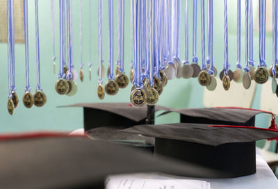Close-up of clothes hanging on metal grate