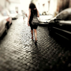 Blurred motion of woman in city