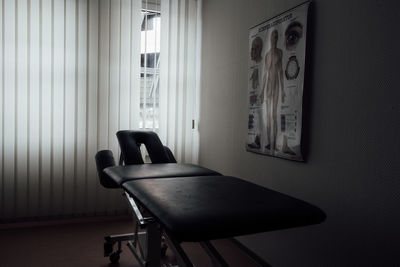 Empty hospital bed in room