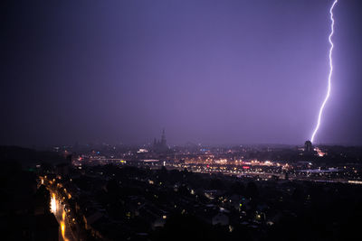 Panoramic view of illuminated city against sky at night