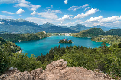 Scenic view of lake and mountains against sky