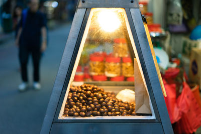 Man for sale at market stall