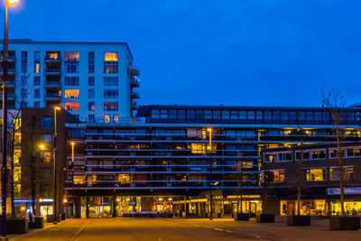 Illuminated building against sky at night