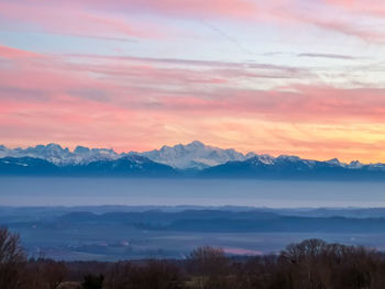 Scenic view of mountains against sky during sunset