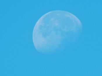 Close-up of moon against blue sky