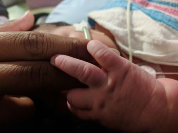 Close-up of people holding hands