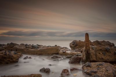 Scenic view of sea against sky at sunset