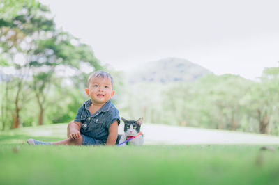 Portrait of cute baby girl against plants