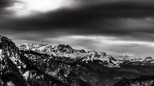 Close-up of snow on mountain against sky
