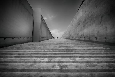 Staircase by steps against sky