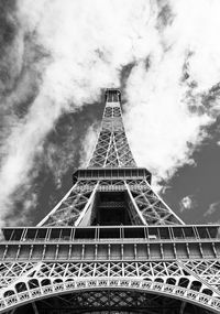 Low angle view of tower against cloudy sky