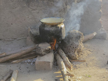 Old pot on fire