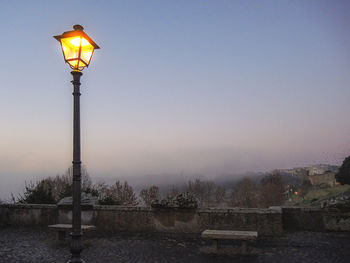 Street light against sky at dusk
