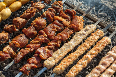 High angle view of meat on barbecue grill