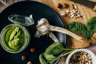 High angle view of food on table with garlic and spinach 